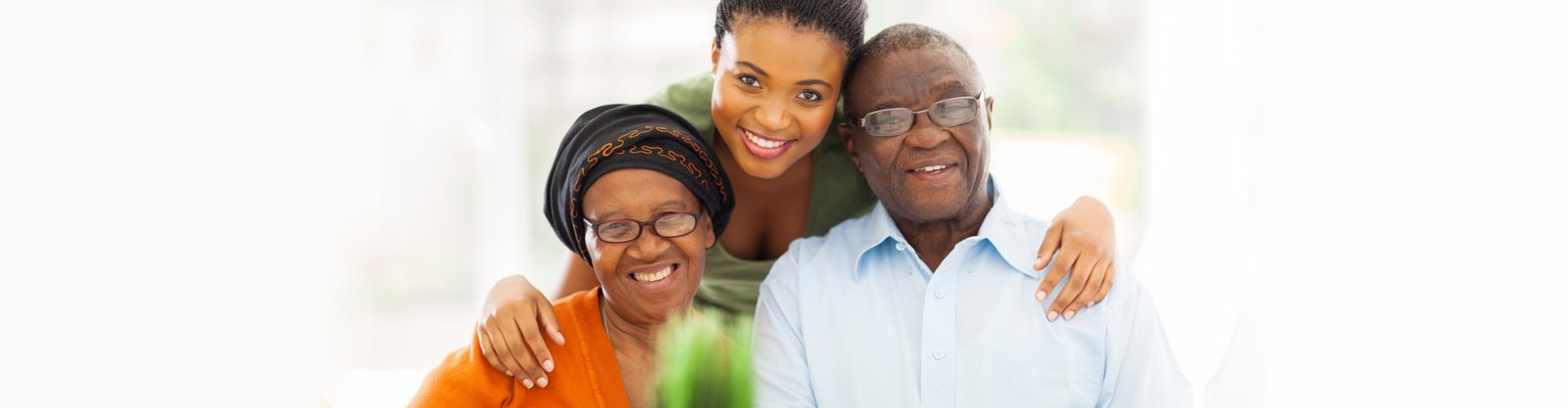 senior couple and adult woman smiling